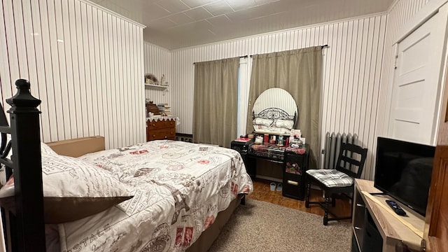 carpeted bedroom with radiator heating unit