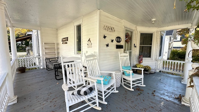 wooden deck featuring a porch