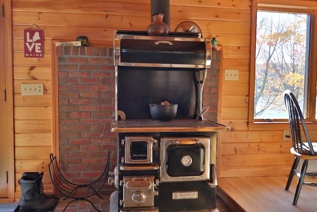 room details with wood walls and hardwood / wood-style floors