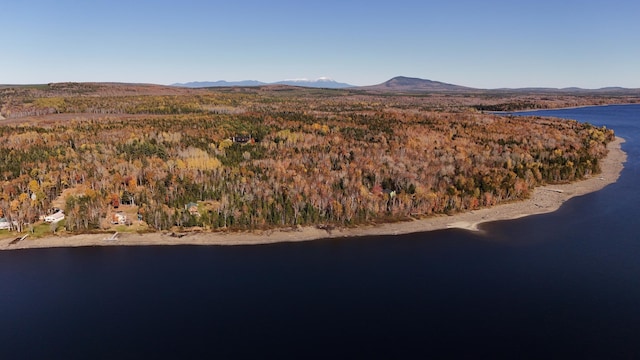 aerial view featuring a water and mountain view