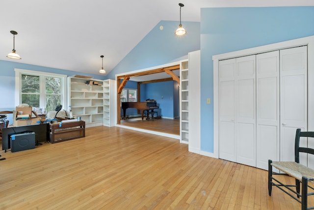 interior space featuring light hardwood / wood-style flooring and high vaulted ceiling