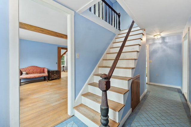 staircase featuring hardwood / wood-style floors