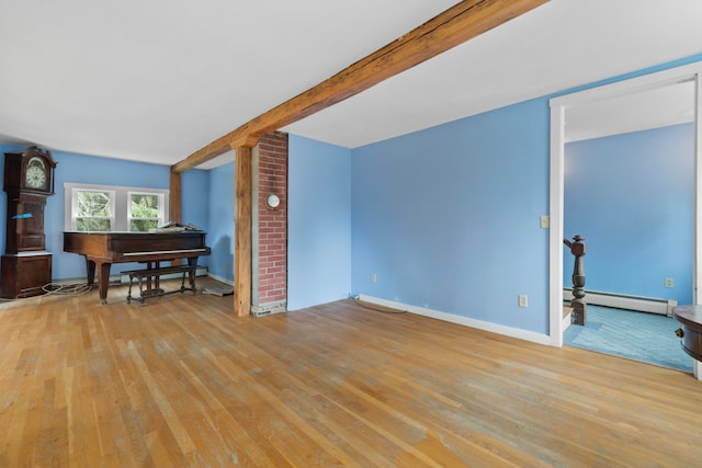 living room with light hardwood / wood-style floors, beamed ceiling, and a baseboard heating unit