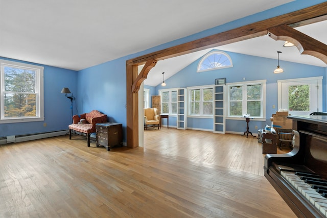 sitting room with a baseboard radiator, lofted ceiling with beams, and light wood-type flooring