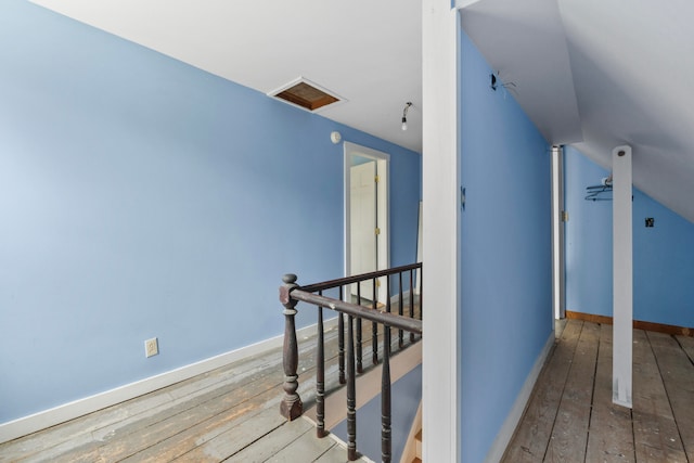 interior space featuring vaulted ceiling and hardwood / wood-style floors