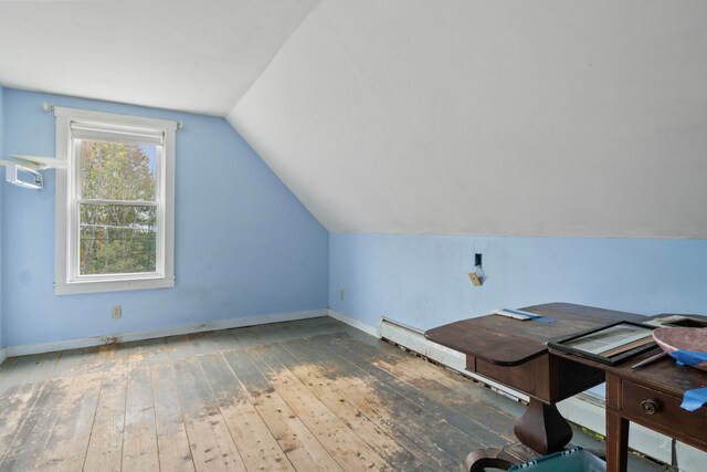 bonus room featuring lofted ceiling and hardwood / wood-style flooring