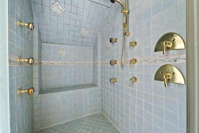 bathroom with tiled shower