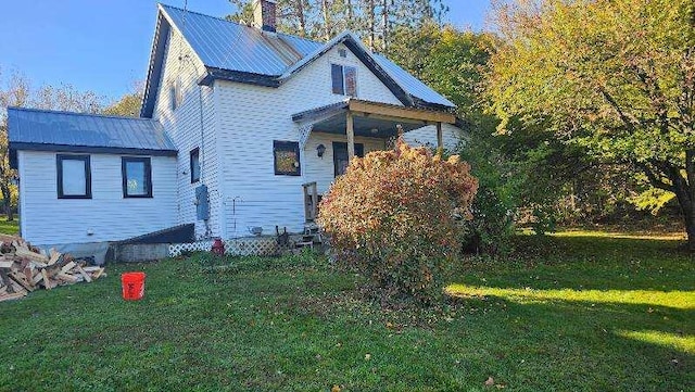 view of property exterior featuring a lawn