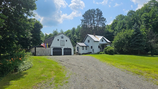 view of front of home featuring a garage and a front yard