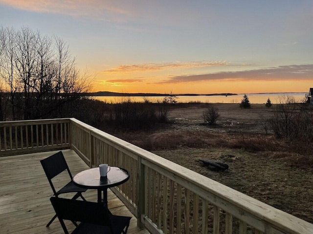 deck at dusk with a water view