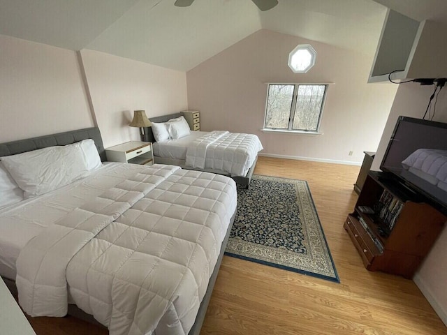 bedroom featuring vaulted ceiling and light hardwood / wood-style floors