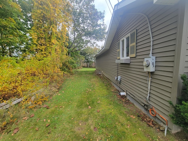 view of home's exterior with a lawn