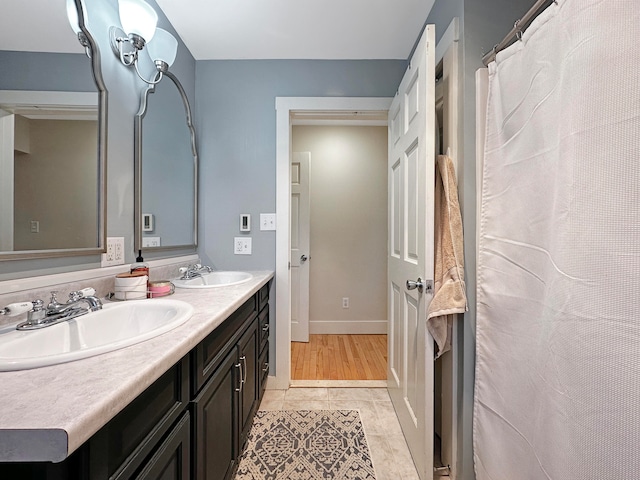 bathroom with vanity and tile patterned floors