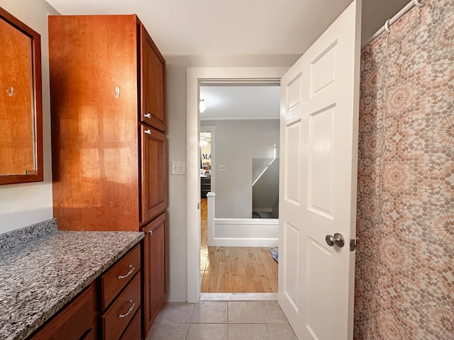 bathroom with vanity, ornamental molding, and hardwood / wood-style flooring