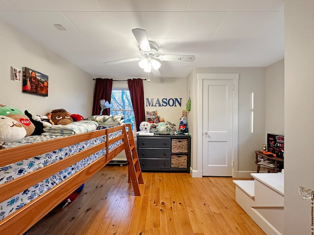 bedroom with hardwood / wood-style floors and ceiling fan