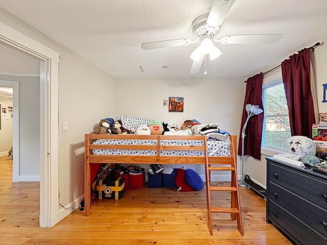 bedroom featuring hardwood / wood-style floors and ceiling fan