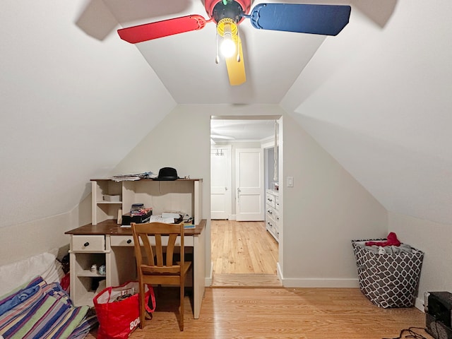 home office with ceiling fan, wood-type flooring, and lofted ceiling