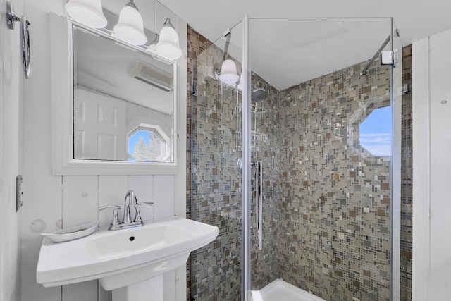 bathroom with sink and an enclosed shower