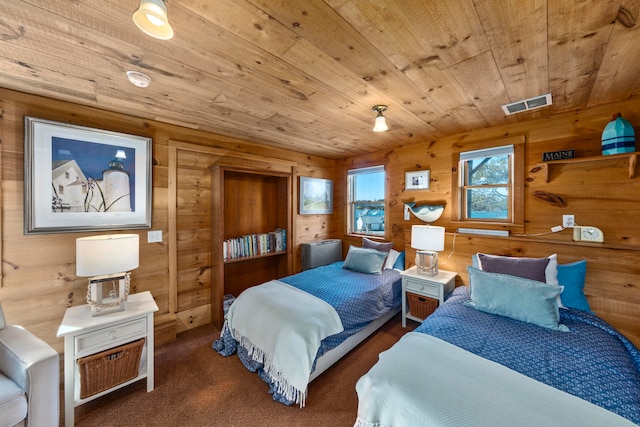 carpeted bedroom featuring wooden walls and wooden ceiling