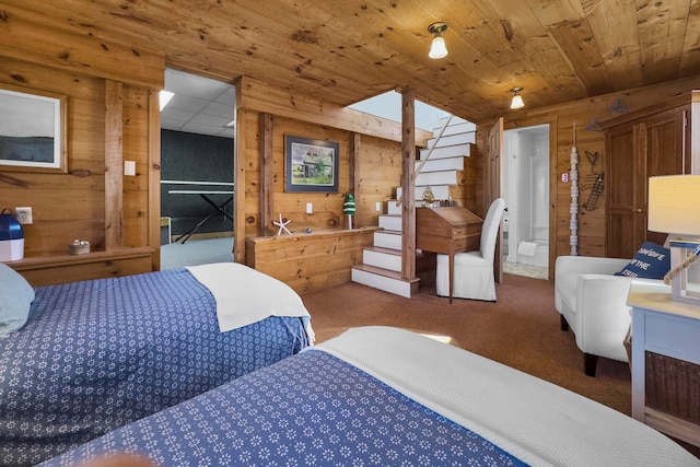 bedroom featuring wood ceiling, carpet, and wooden walls