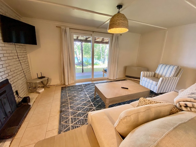 tiled living room featuring ornamental molding and a fireplace