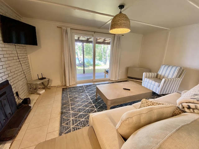 tiled living room featuring a brick fireplace