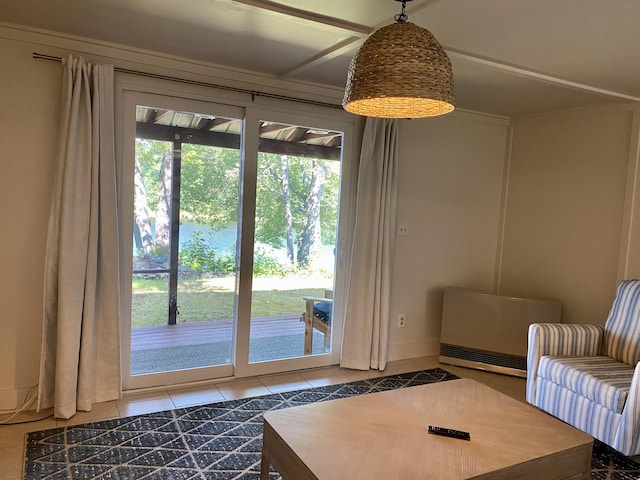 living area featuring tile patterned floors and baseboards