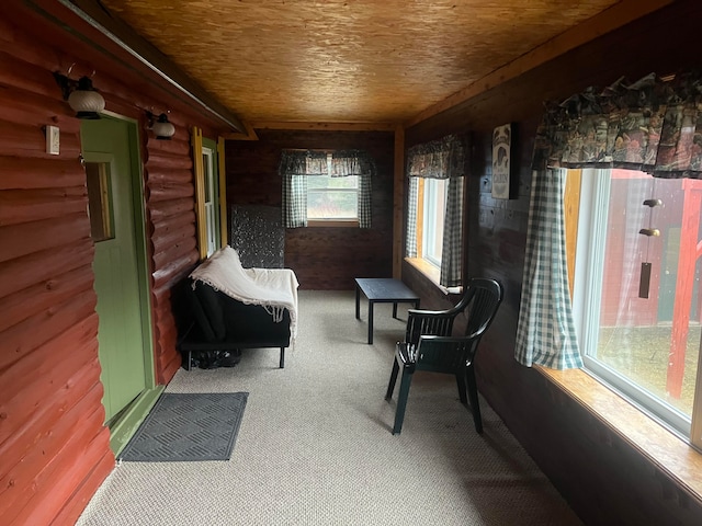 sitting room featuring wood walls