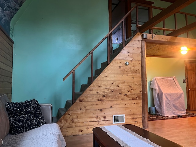 staircase with wood-type flooring