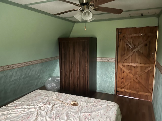 bedroom featuring hardwood / wood-style flooring and ceiling fan