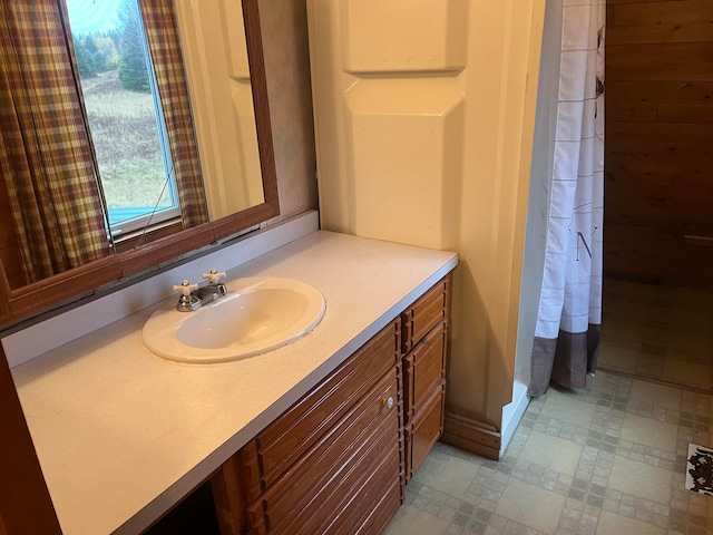 bathroom featuring vanity and walk in shower