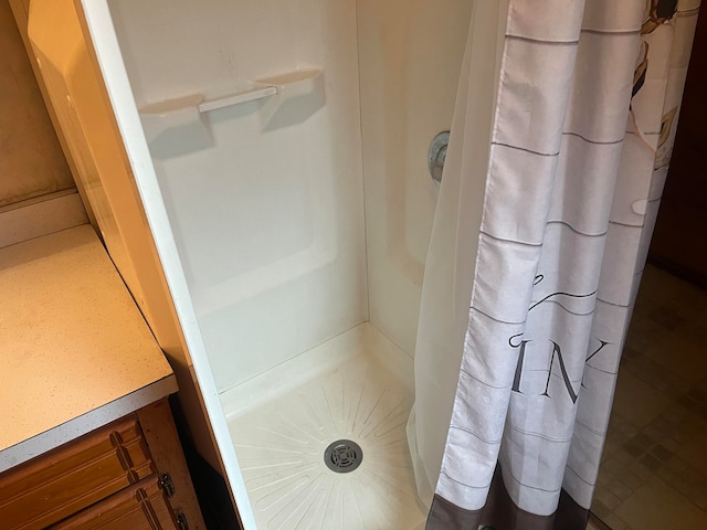 bathroom with a shower with curtain