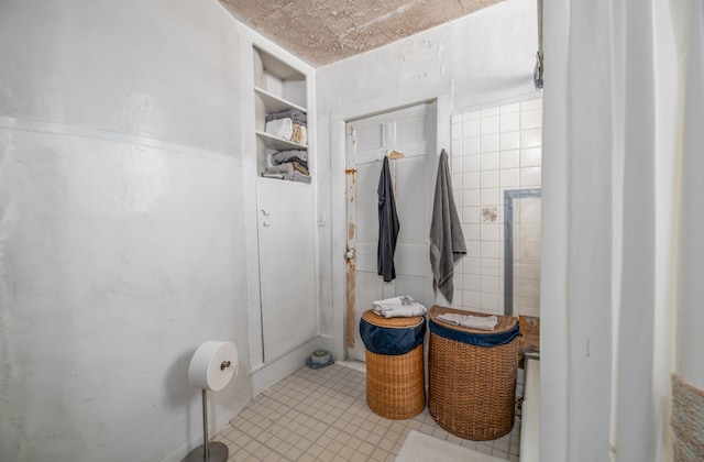 bathroom with tile walls