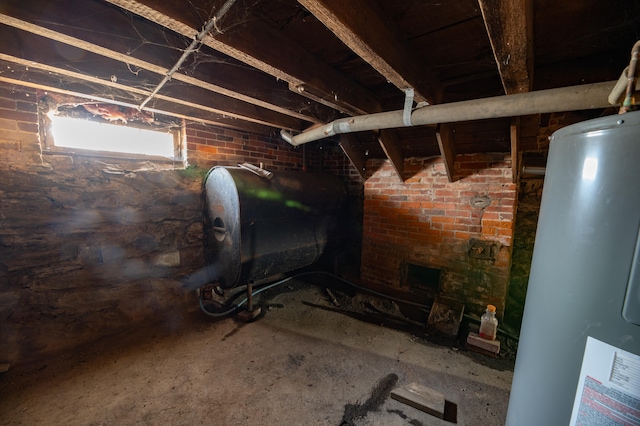 basement with brick wall and gas water heater