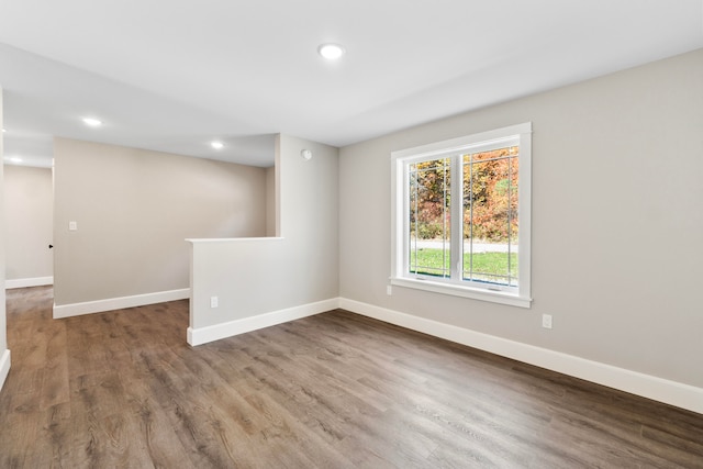 unfurnished room featuring hardwood / wood-style floors