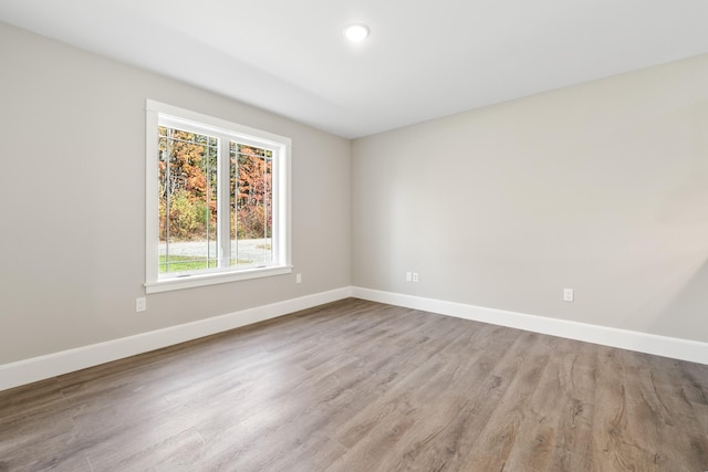 empty room with light hardwood / wood-style floors