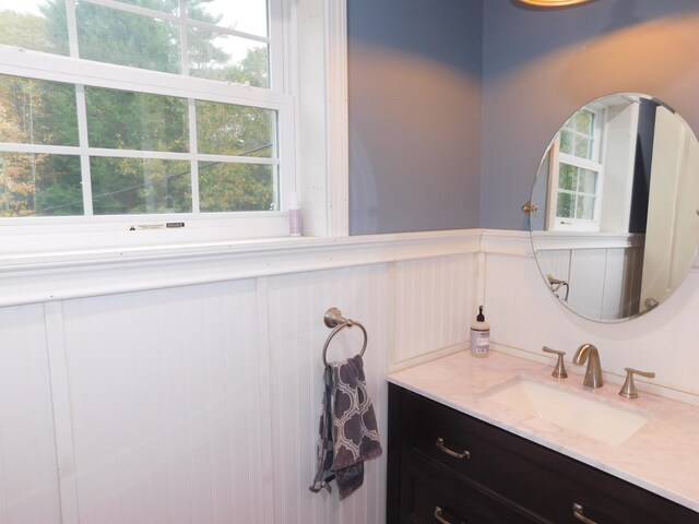 bathroom featuring wainscoting and vanity