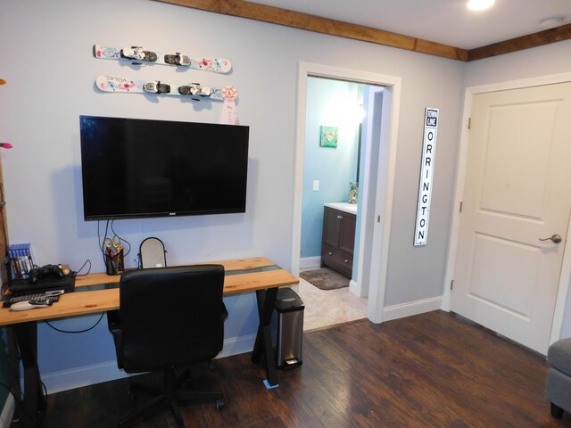 office featuring dark wood-style flooring and baseboards