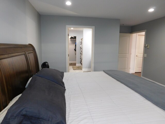 bedroom with baseboards and recessed lighting