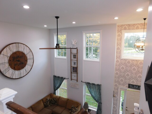 living area with an inviting chandelier and recessed lighting