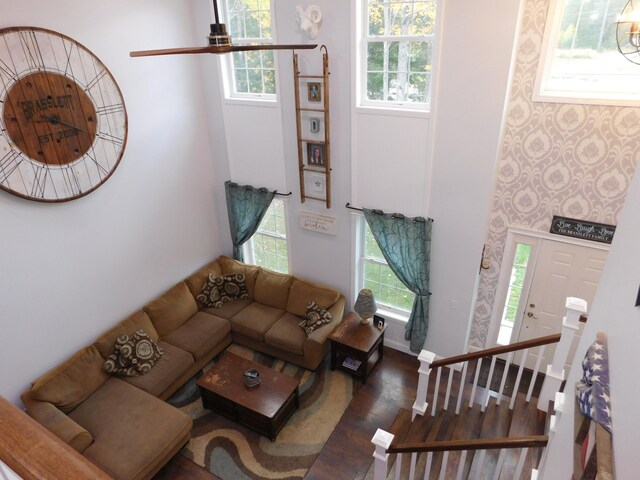 living room featuring wood finished floors and baseboards