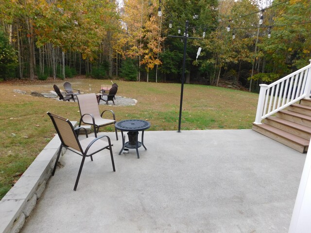 view of patio featuring a wooded view