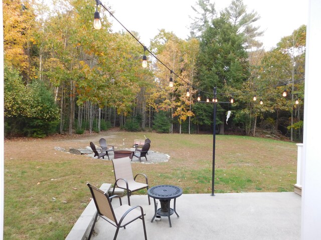 view of patio with an outdoor fire pit