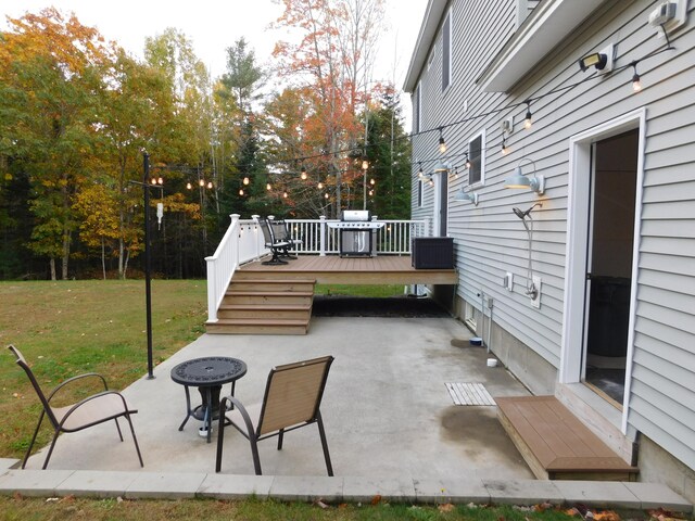 view of patio / terrace with a deck and a grill