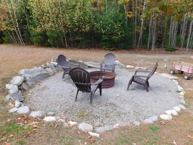 view of patio / terrace with an outdoor fire pit