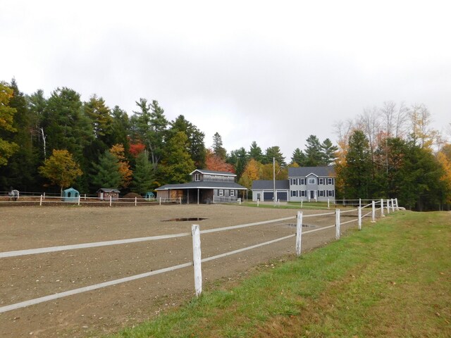 exterior space featuring an outdoor structure and fence