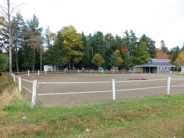 surrounding community featuring an enclosed area and fence