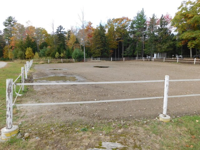 exterior space featuring an enclosed area and fence