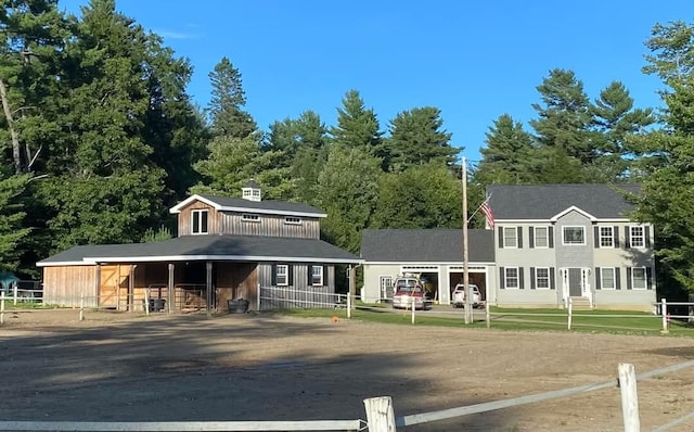 view of front of property featuring an exterior structure and an outdoor structure