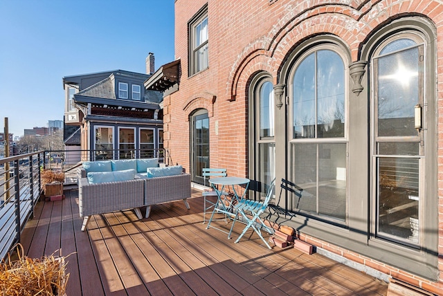 wooden terrace with outdoor lounge area